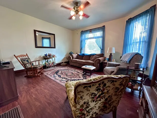 a living room with furniture and a window