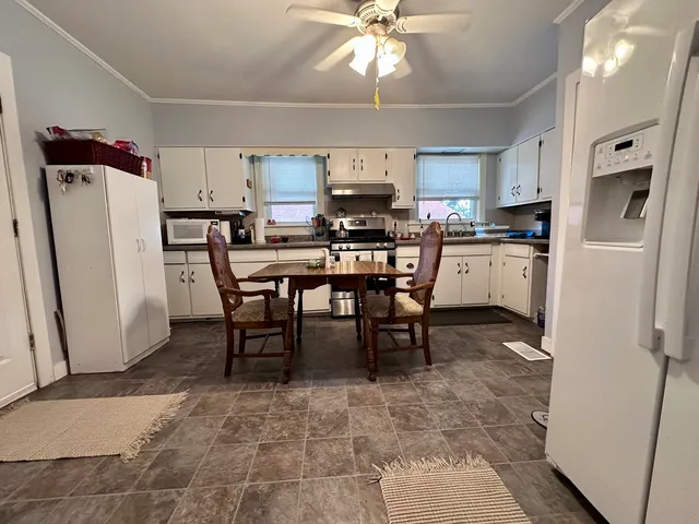 a view of a dining room with furniture