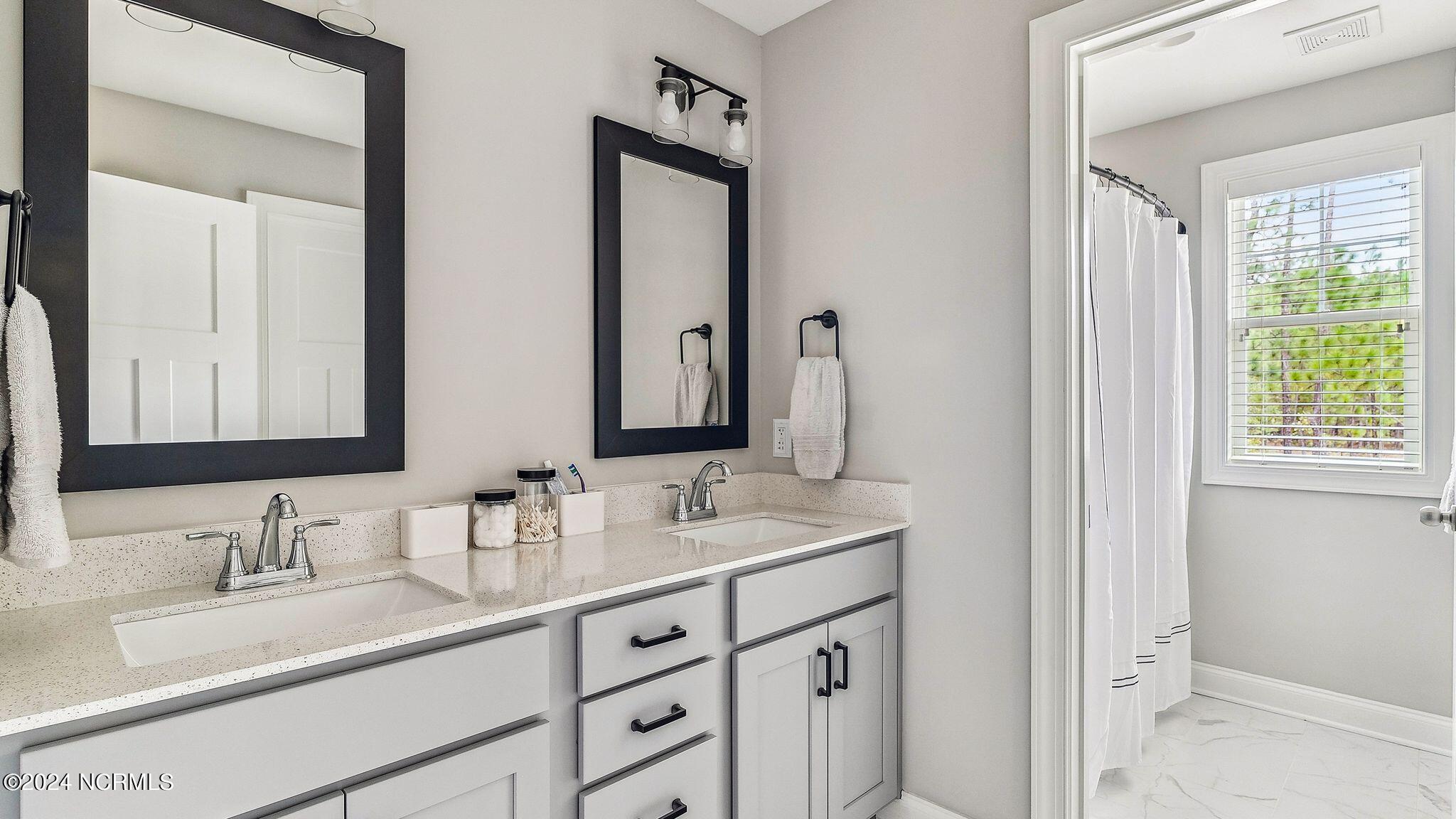 424 Gretchen Road West End, NC 27376 - Photo 23 of 40 Upstairs hall bath with double sinks and tub