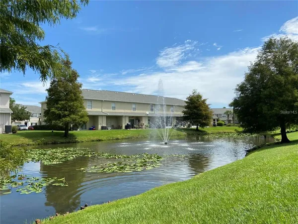 a view of a lake with a big yard