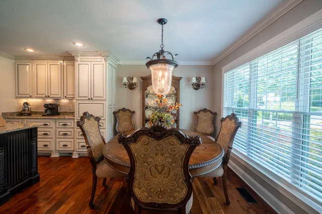 a view of a dining room with furniture window and outside view