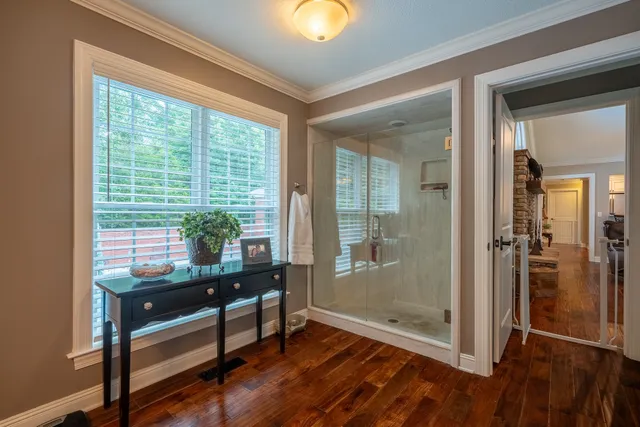 a view of a hallway with windows