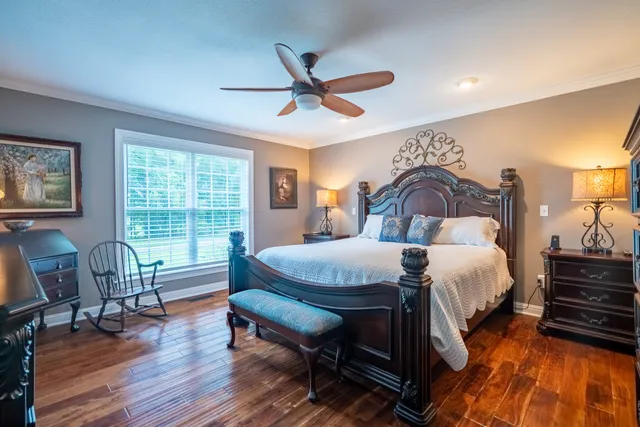 a bedroom with a bed and a dresser