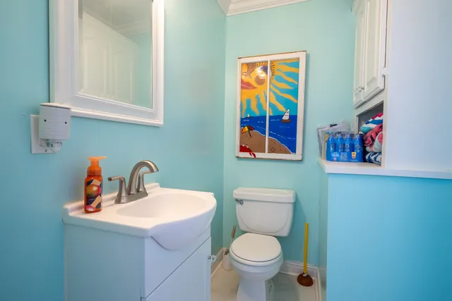 a view of a livingroom with furniture and a window