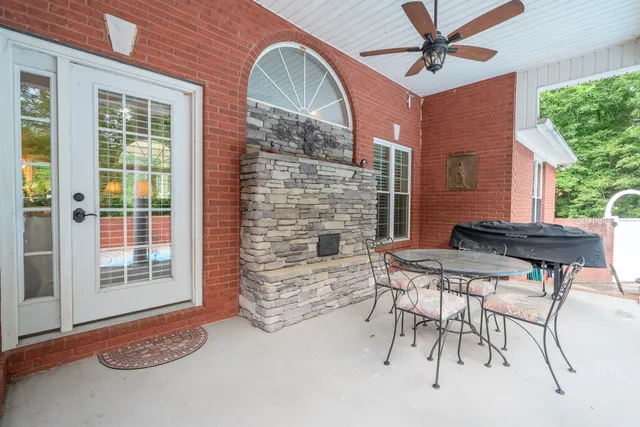 a dining room with furniture and a window