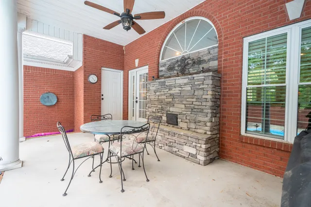 a view of a swimming pool with a yard