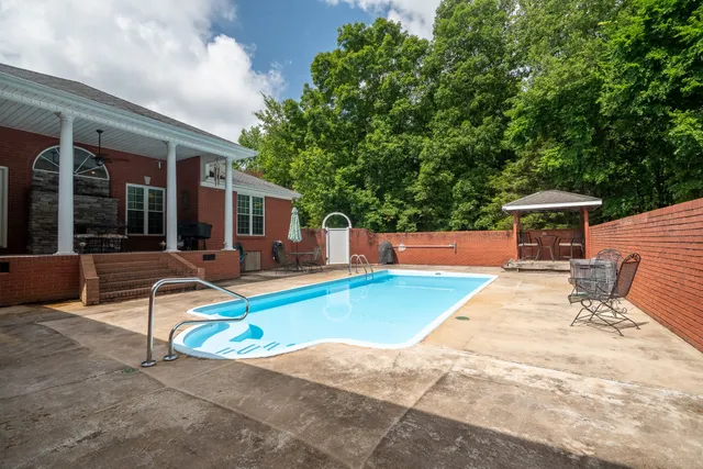 a view of outdoor space pool patio and outdoor seating