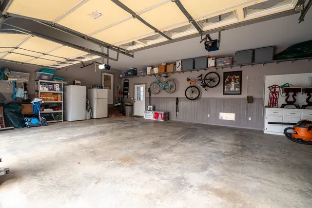 a view of parking garage with cars