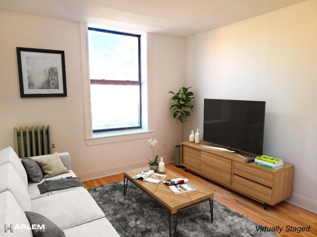 36 West 138th Street, Unit 52 Manhattan, NY 10037 - Photo 1 of 9 a living room with furniture and a flat screen tv