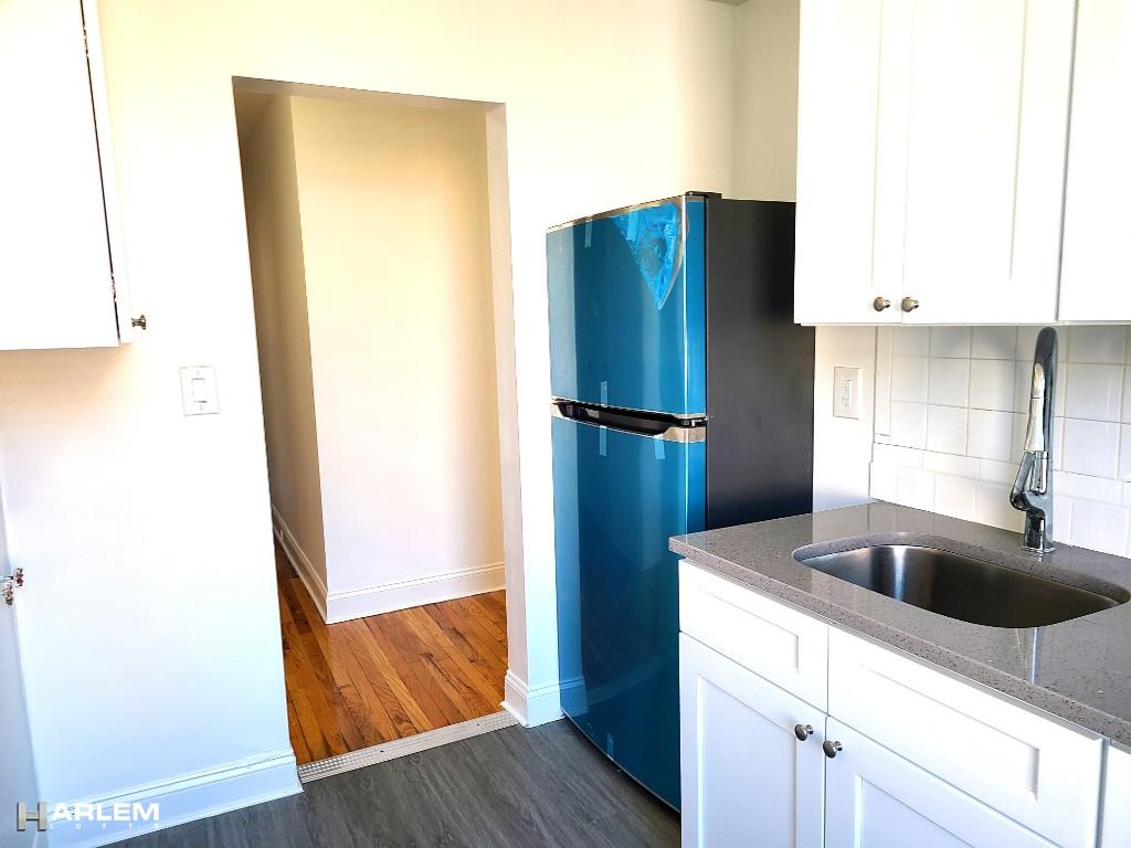 36 West 138th Street, Unit 52 Manhattan, NY 10037 - Photo 6 of 11 a kitchen with metallic refrigerator and sink