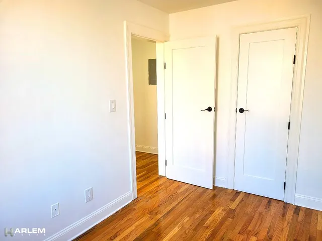 a view of a small space with wooden floor