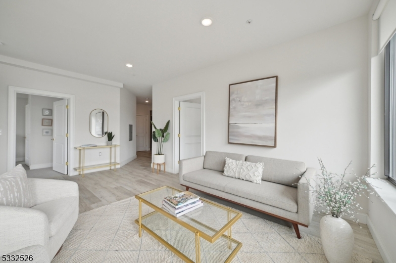 45 South Grove Street, Unit 232 East Orange, NJ 07018 - Photo 2 of 22 a living room with furniture and wooden floor