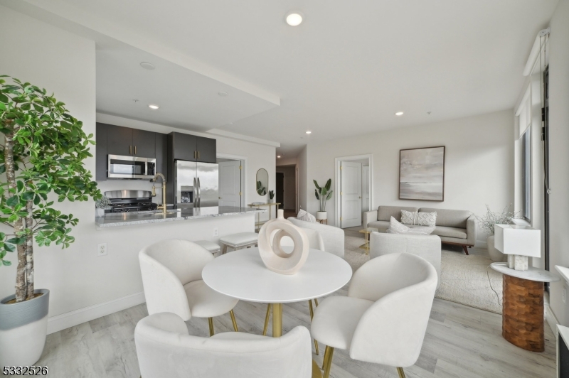 45 South Grove Street, Unit 232 East Orange, NJ 07018 - Photo 4 of 22 a living room with fireplace furniture and a potted plant