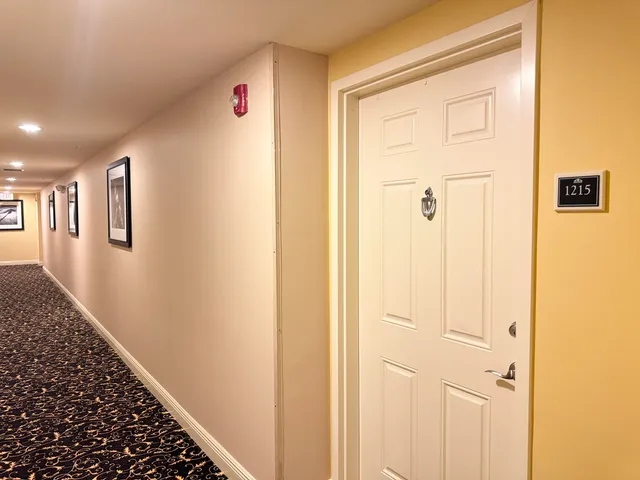 a view of a hallway with closet
