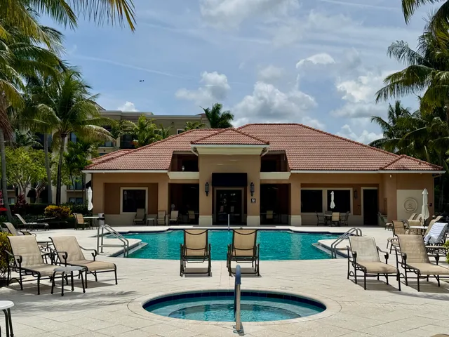 a view of a lake in a patio with swimming pool
