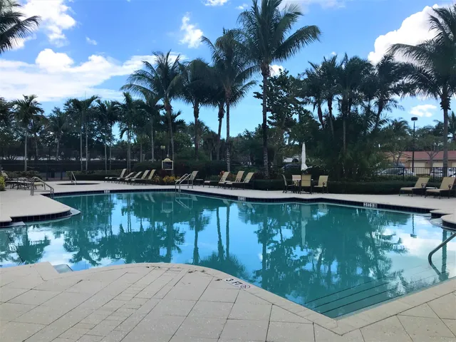 a view of a living room and kitchen