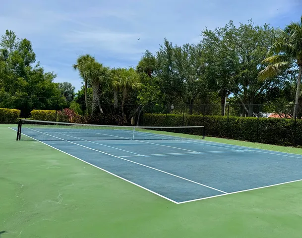 a view of a cars parked on the side of a street