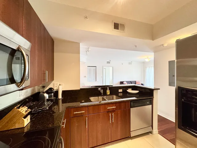 a kitchen with a sink and cabinets