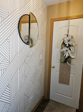 a living room with furniture a refrigerator and a table