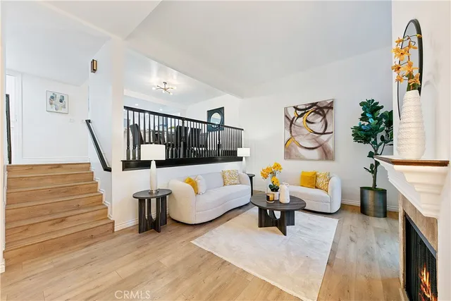 a living room with furniture and stairs