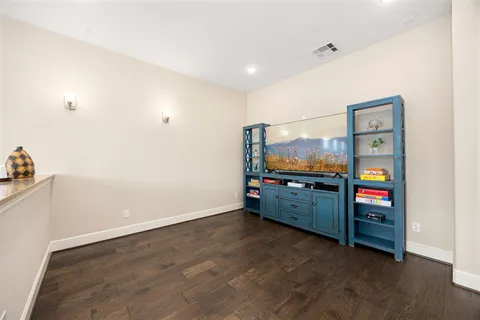 a living room with furniture and flat screen tv