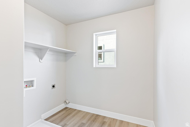 257 North Slant Road, Unit 51M Mapleton, UT 84660 - Photo 11 of 24 Laundry area featuring hookup for an electric dryer, washer hookup, and light wood-style floors