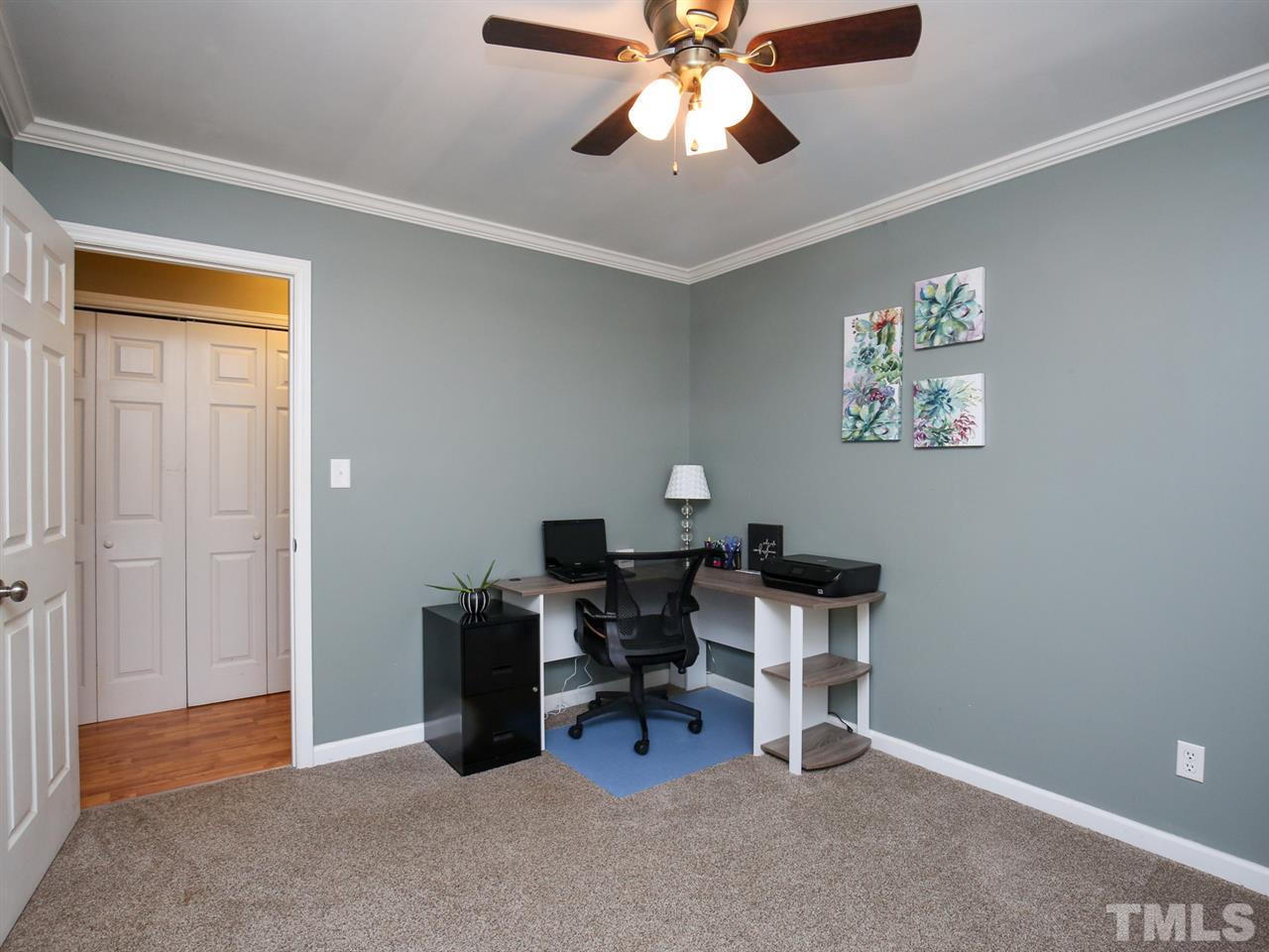 1811 Southview Road Durham, NC 27703 - Photo 22 of 30 a view of a workspace with furniture and a window
