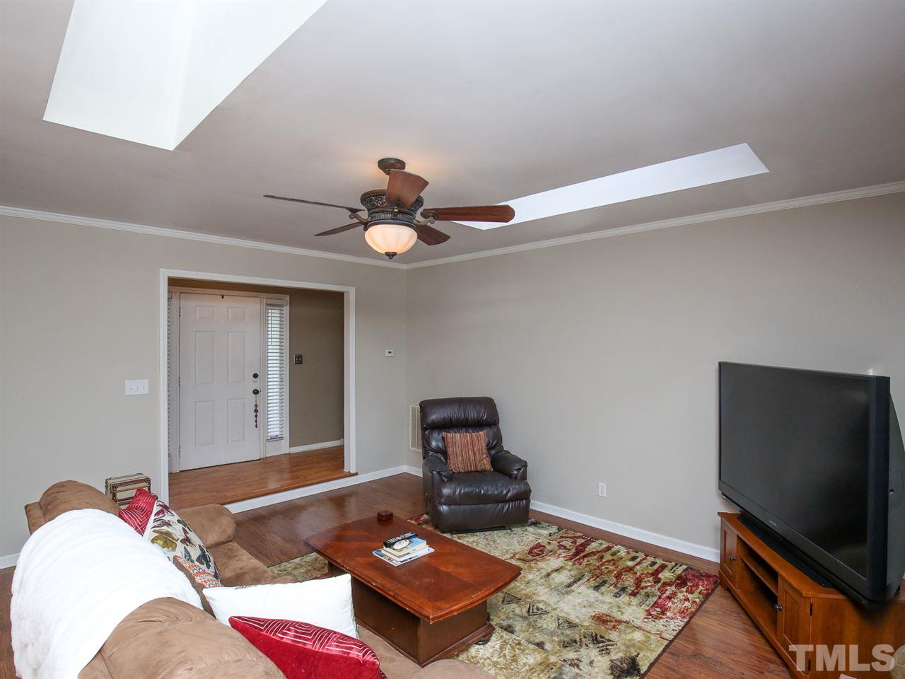 1811 Southview Road Durham, NC 27703 - Photo 6 of 30 a bedroom with a bed and a flat screen tv
