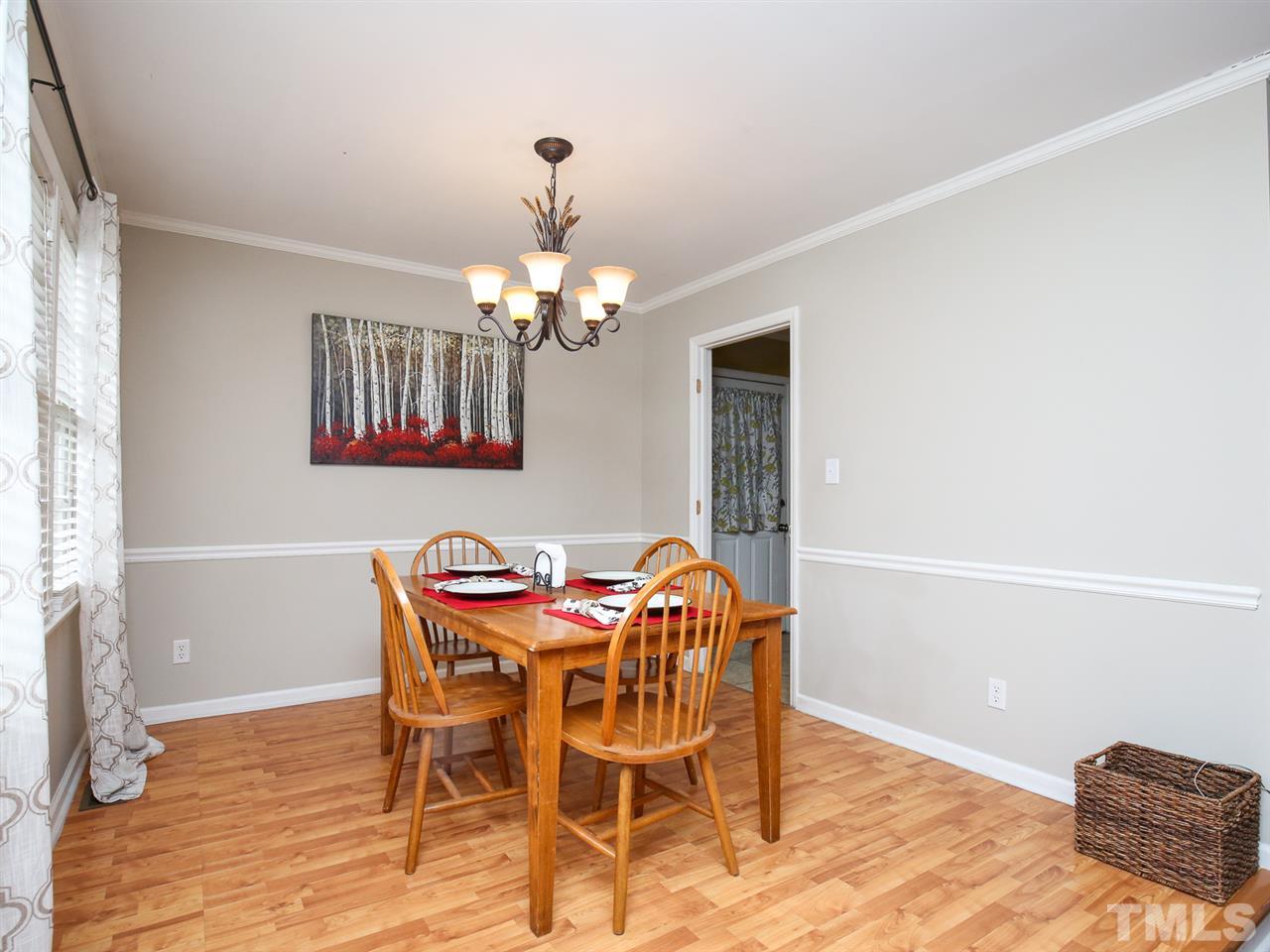 1811 Southview Road Durham, NC 27703 - Photo 8 of 30 a view of a dining room with furniture and chandelier