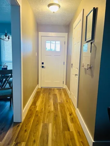 a view of bathroom with bathtub and wooden floor