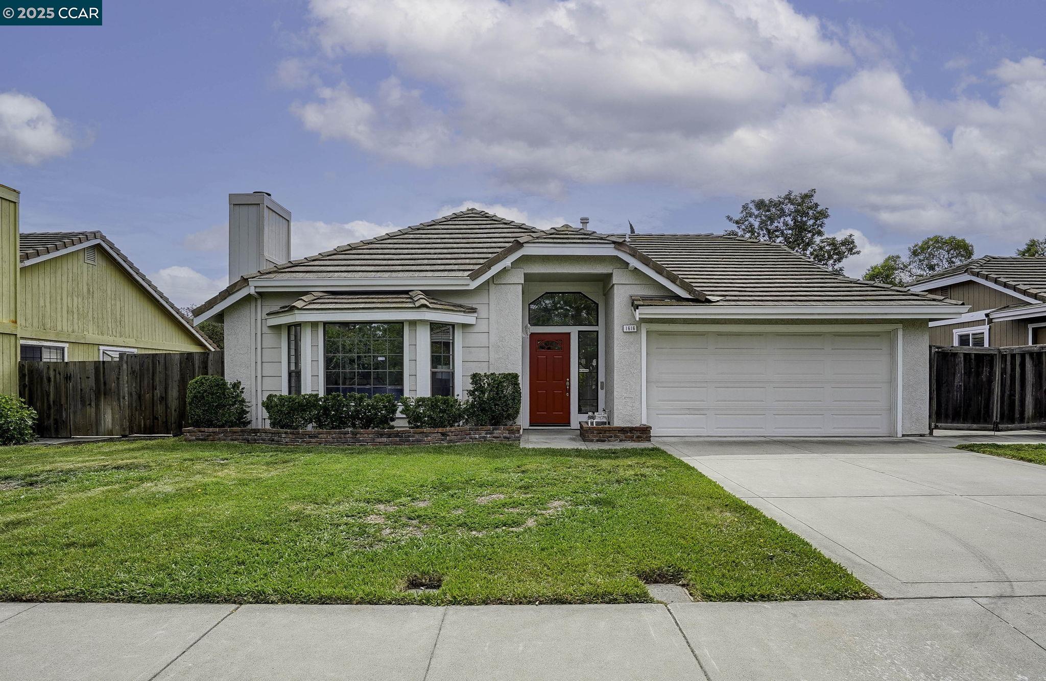 1616 Lindbergh Drive Concord, CA 94521 - Photo 1 of 1 a front view of a house with a yard and garage