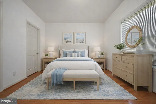 a bedroom with a bed and a dresser
