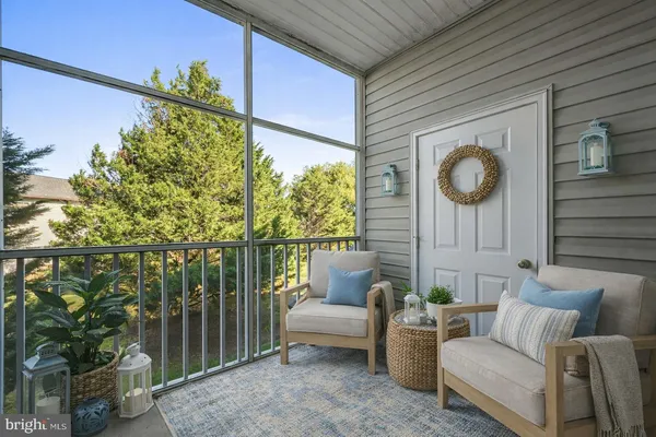 a view of a two chairs in the balcony