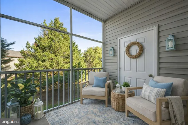 a view of a two chairs in the balcony