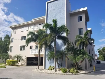 a front view of house with small garden