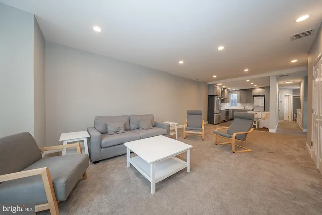 a living room with furniture and a table