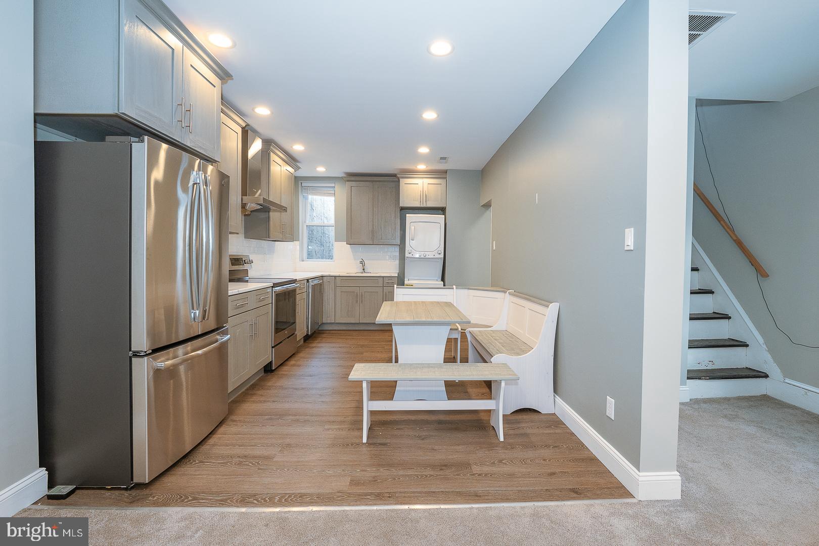 524 South 3rd Street Philadelphia, PA 19147 - Photo 6 of 22 a kitchen with white cabinets and stainless steel appliances