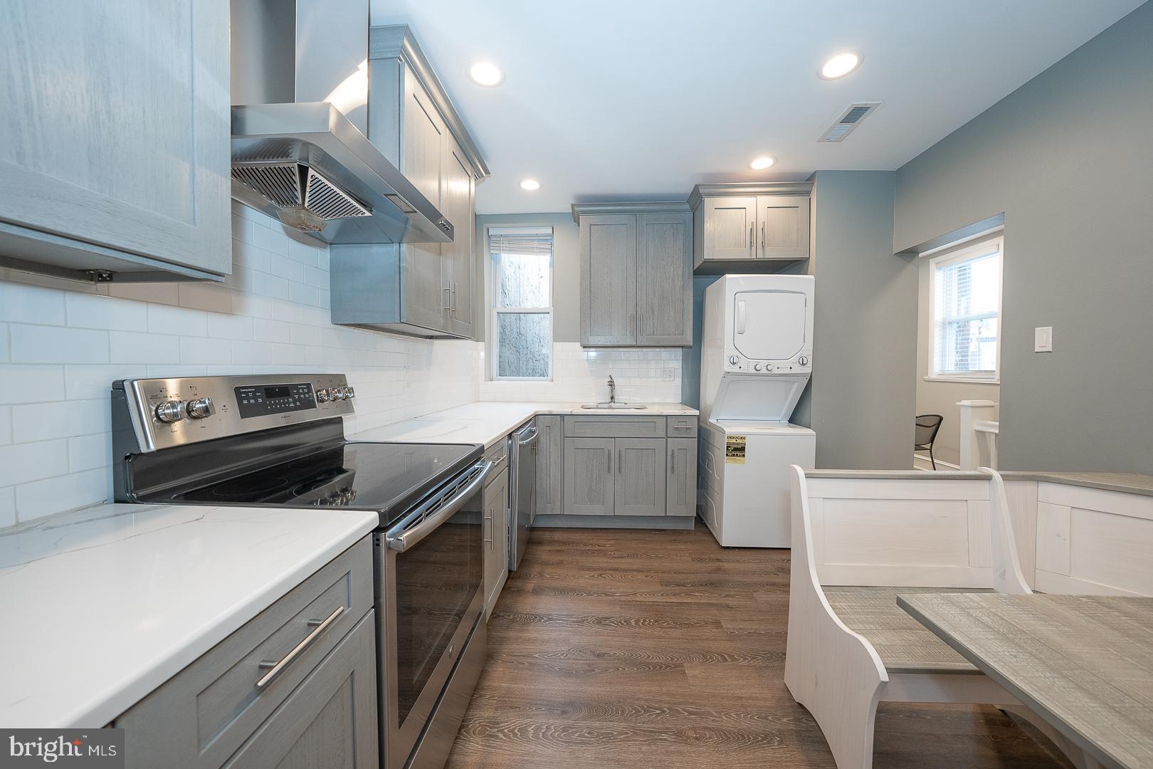 524 South 3rd Street Philadelphia, PA 19147 - Photo 7 of 22 a kitchen with a sink a counter top space stainless steel appliances and cabinets