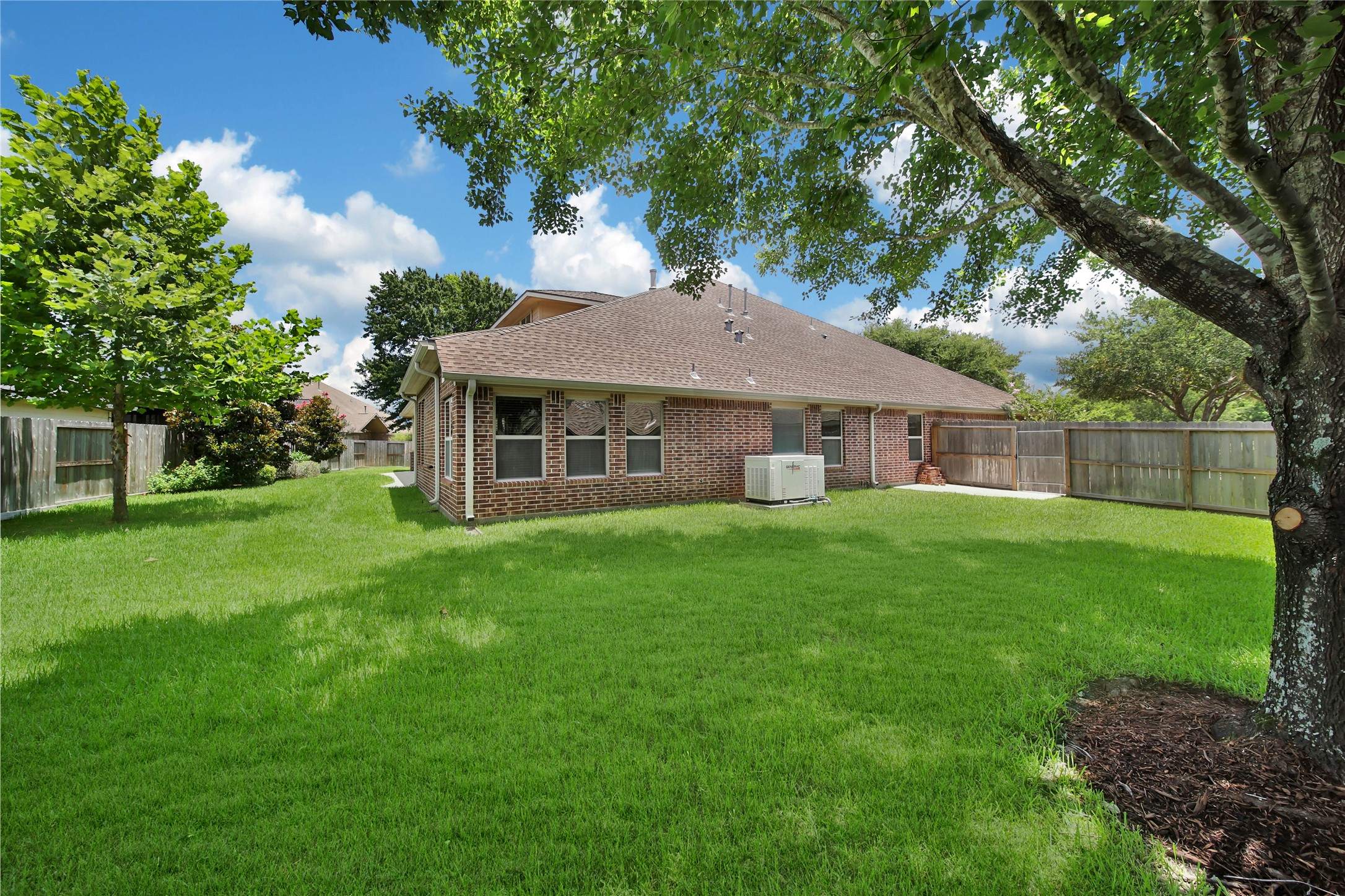1215 Jake Springs Court Spring, TX 77386 - Photo 35 of 49 A large tree on this side offers great shade for afternoon fun.