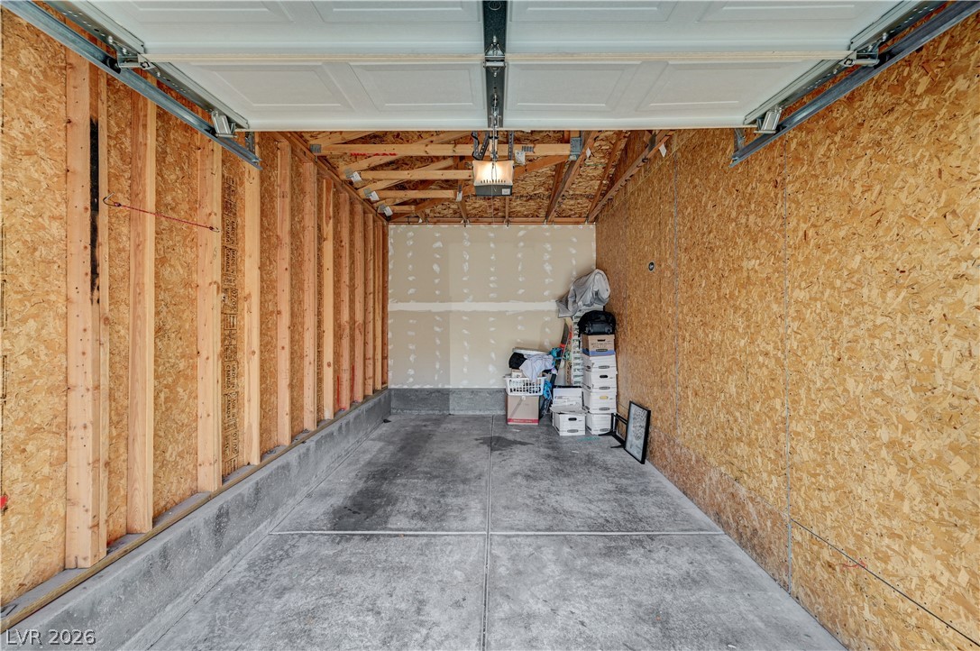 8985 South Durango Drive, Unit 2187 Las Vegas, NV 89113 - Photo 22 of 73 Secure parking or ample storage space within this practical garage.
