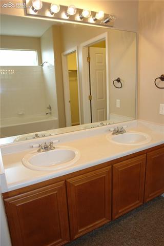 7596 Coffee Road Peyton, CO 80831 - Photo 14 of 25 Dual vanity in Master Bathroom