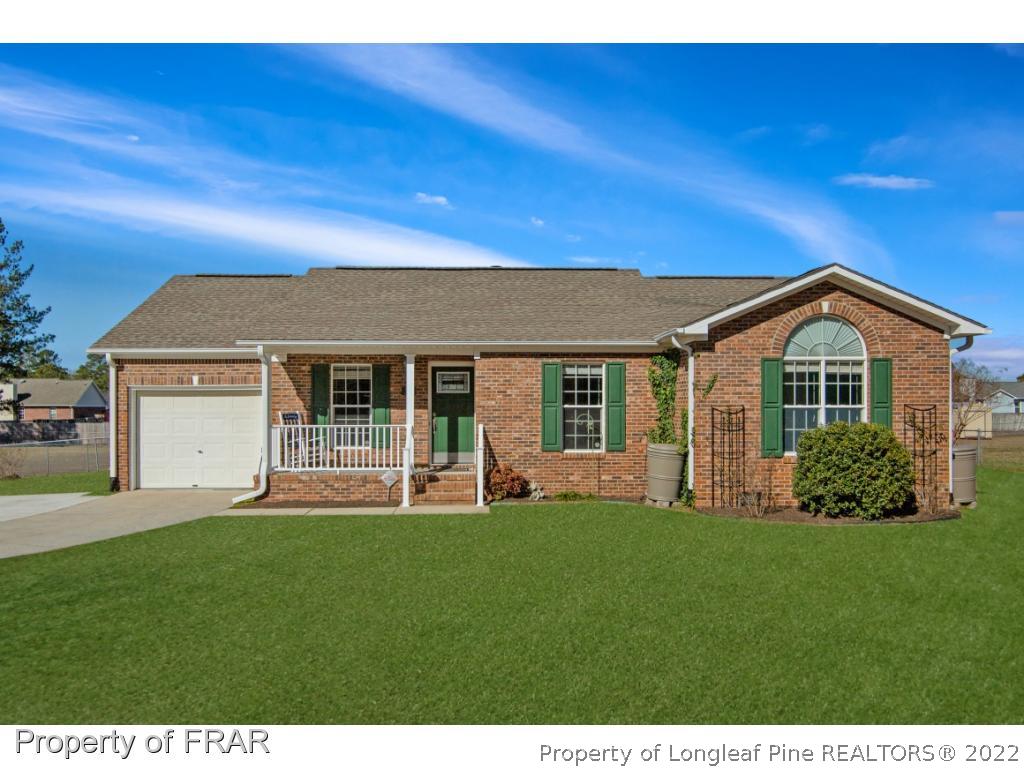 361 Camden Road Raeford, NC 28376 - Photo 1 of 36 a front view of a house with a yard and porch