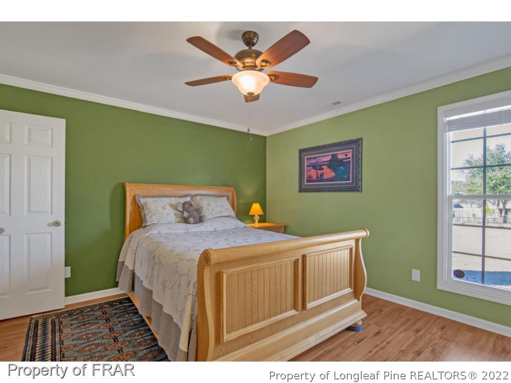 361 Camden Road Raeford, NC 28376 - Photo 18 of 36 a bedroom with a bed and window