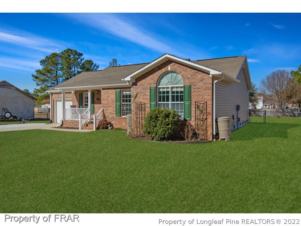 361 Camden Road Raeford, NC 28376 - Photo 2 of 36 a front view of a house with a yard
