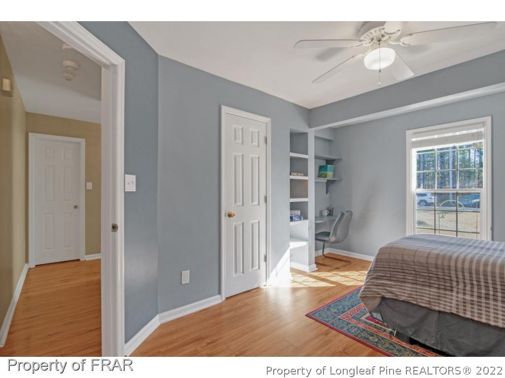 361 Camden Road Raeford, NC 28376 - Photo 22 of 36 a living room with a bed furniture and next to a window