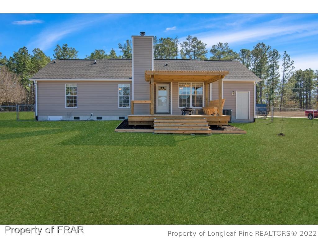 361 Camden Road Raeford, NC 28376 - Photo 29 of 36 a view of a house with a yard