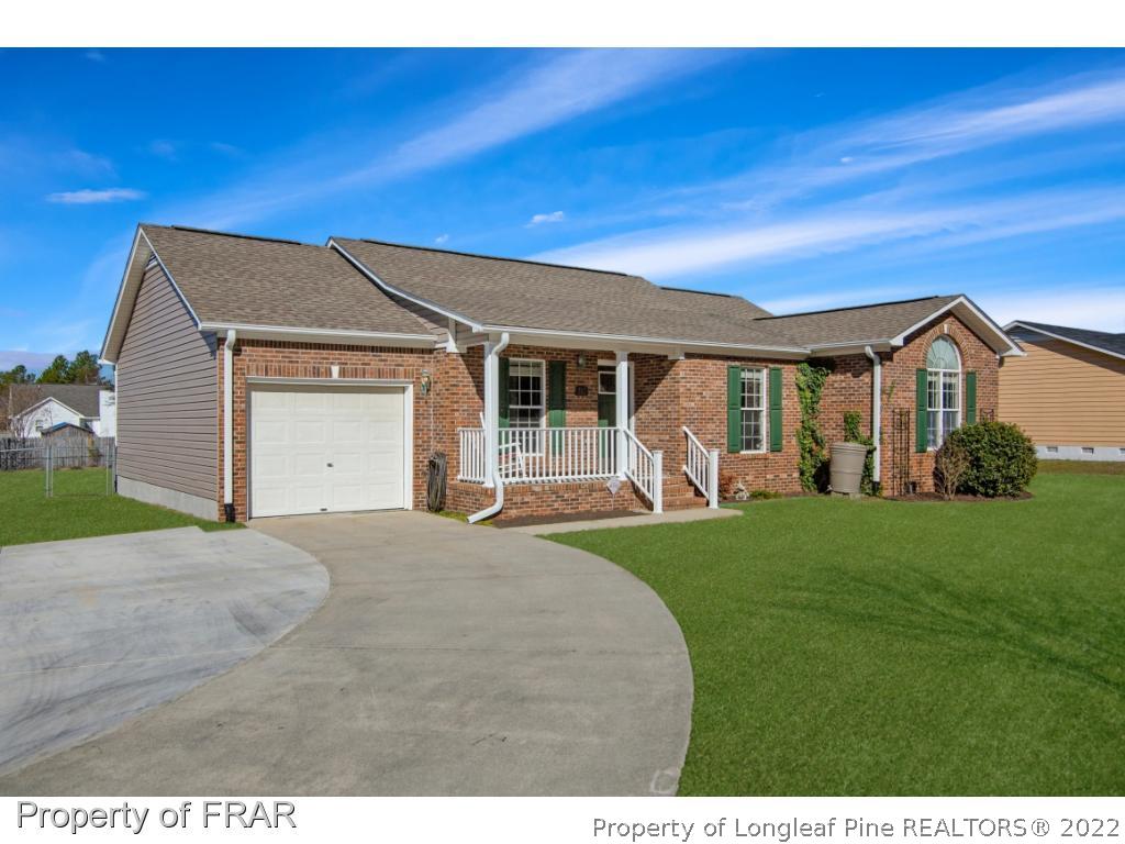 361 Camden Road Raeford, NC 28376 - Photo 3 of 36 a view of a house with a big yard couches and palm trees