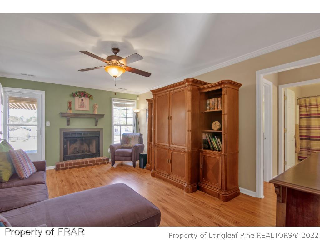361 Camden Road Raeford, NC 28376 - Photo 8 of 36 a living room with furniture and a fireplace