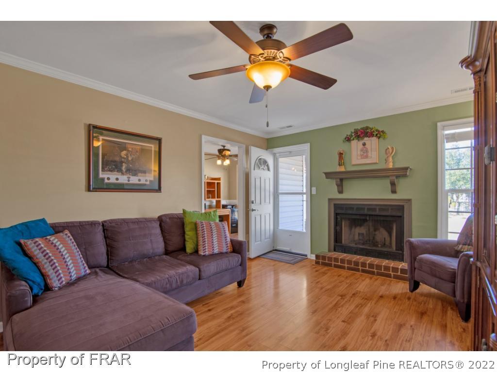 361 Camden Road Raeford, NC 28376 - Photo 9 of 36 a living room with furniture and a fireplace