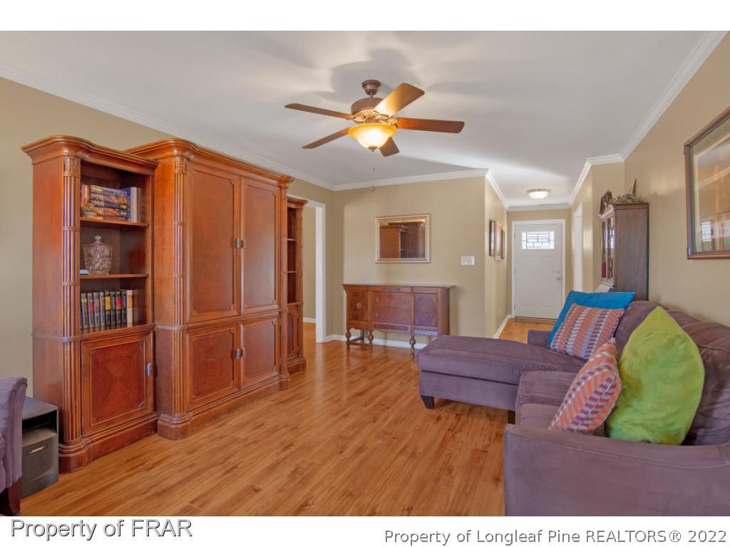 361 Camden Road Raeford, NC 28376 - Photo 10 of 36 a living room with furniture and a kitchen view